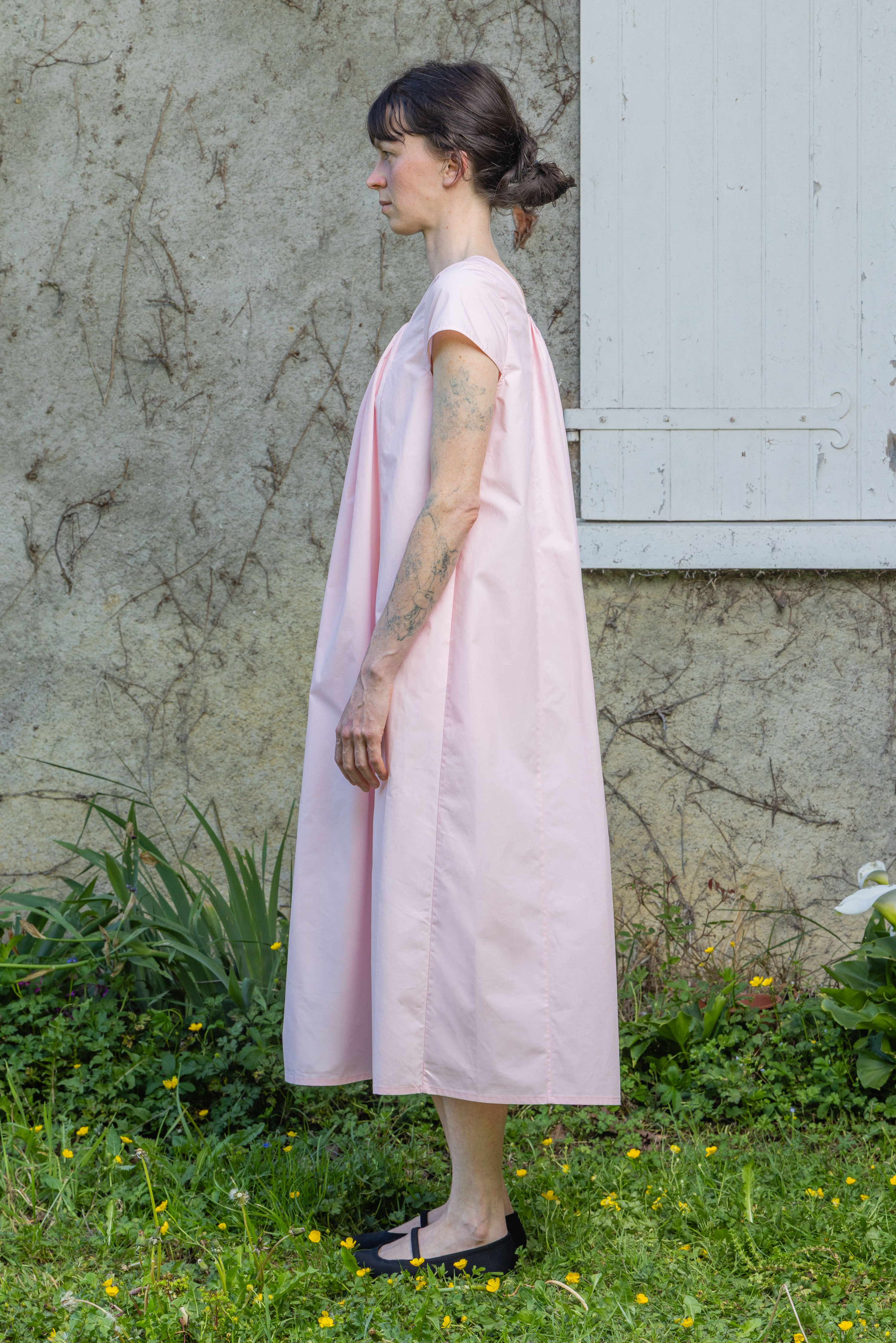 Pink Hier dress, back view with gathered yoke and short sleeves, knee-length