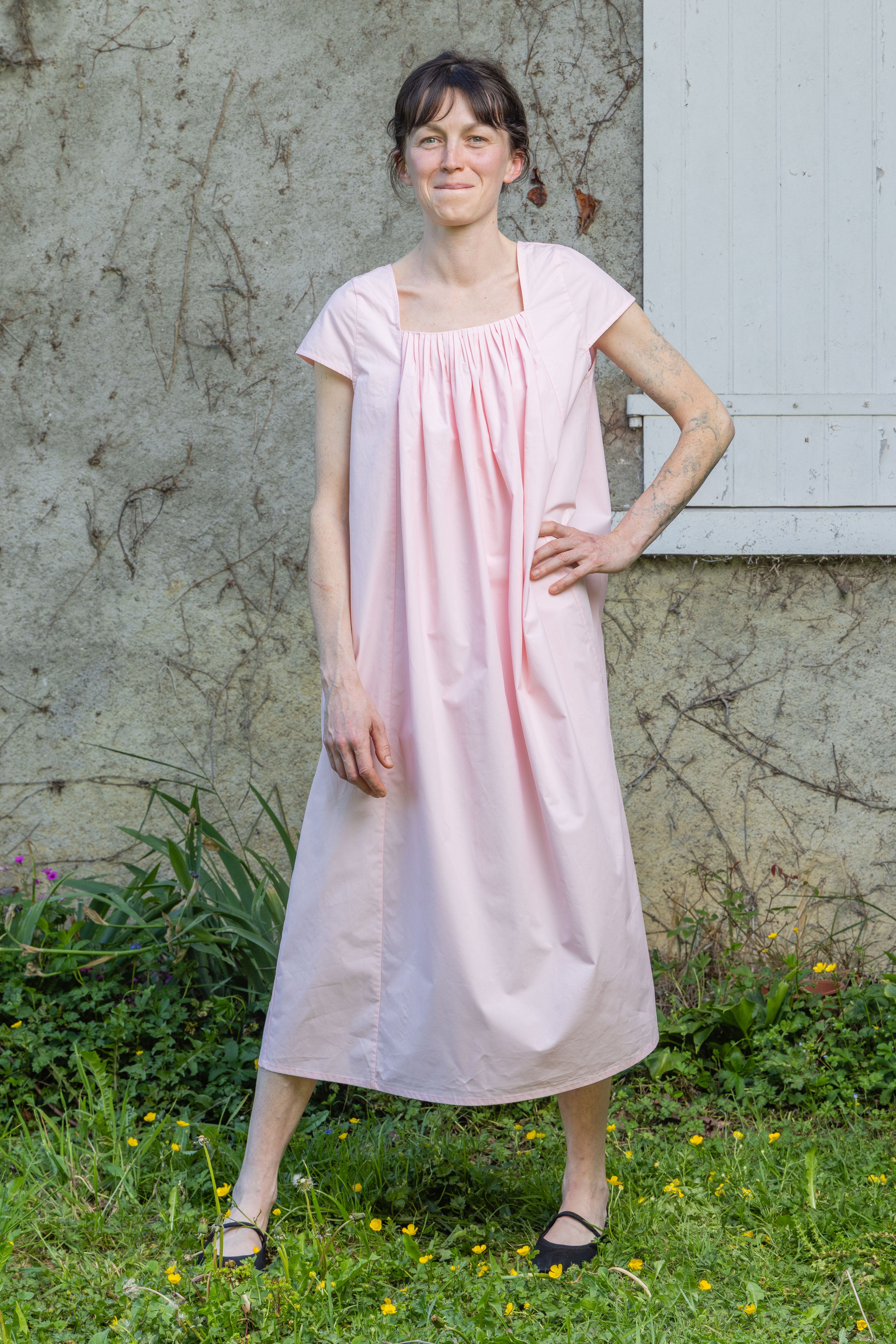 Pink Hier dress with pleated gathered bodice and short sleeves, front view