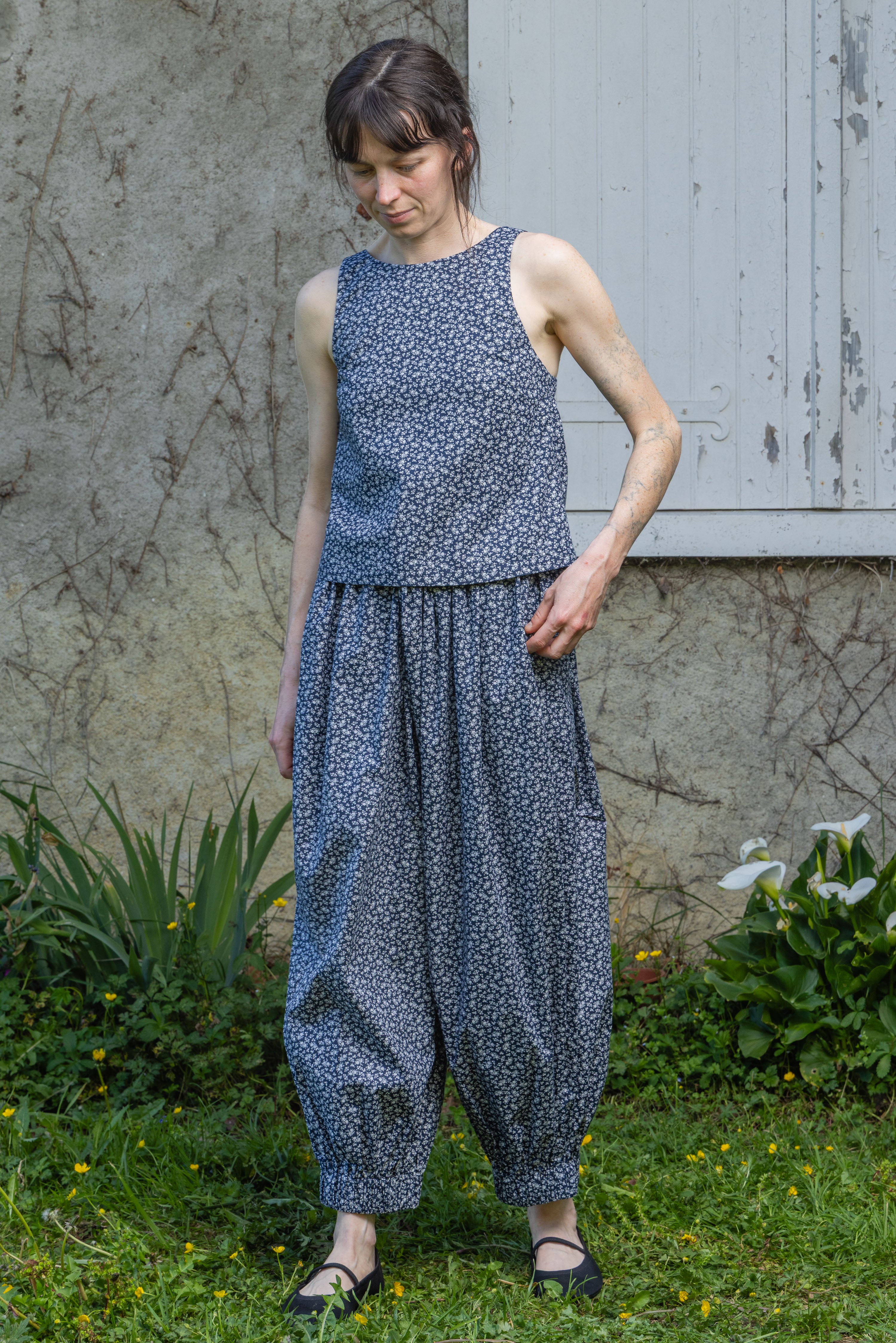 Navy floral sleeveless tank top with round neck and gathered waist hem