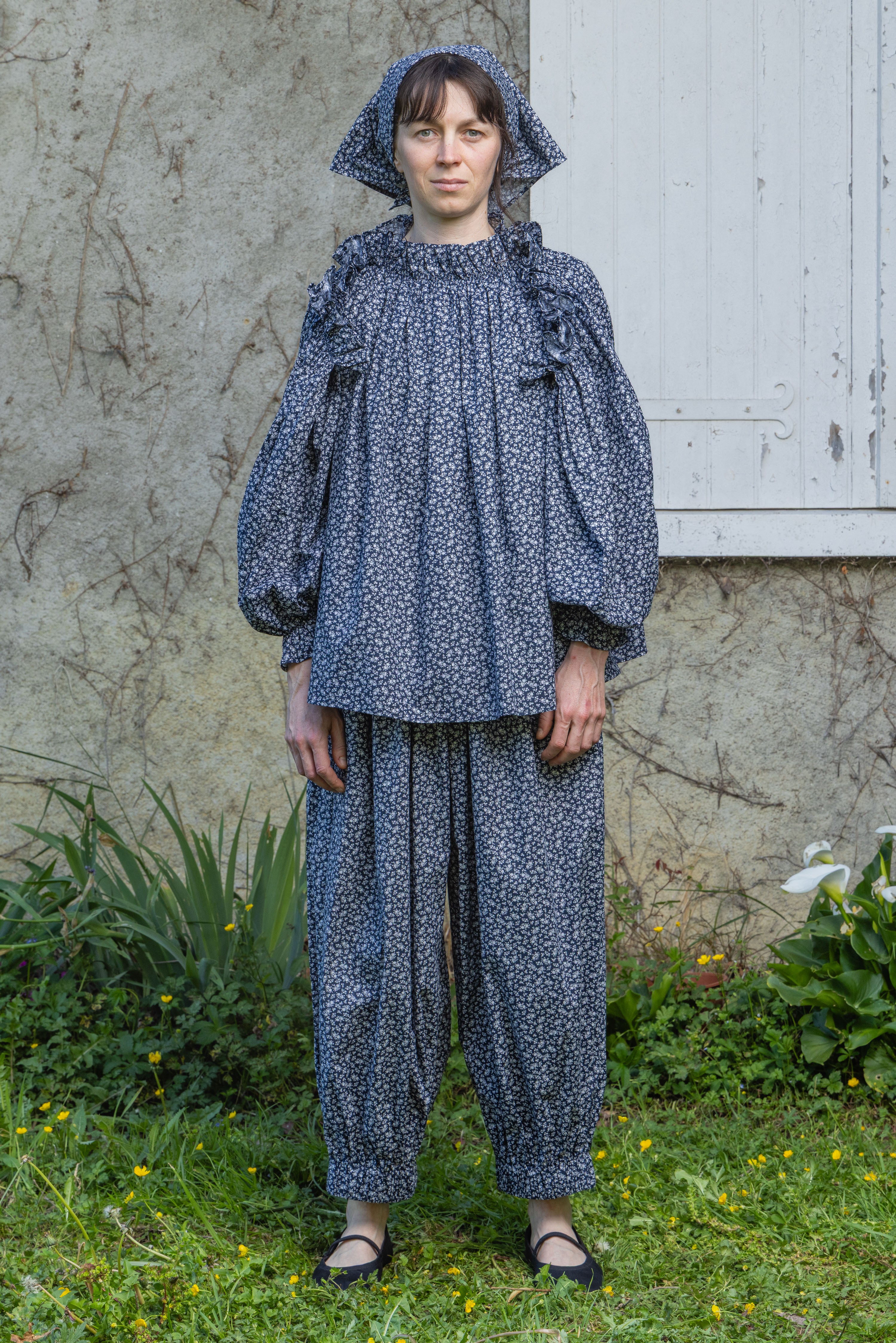 Navy floral peasant top with gathered neckline and balloon sleeves with cap