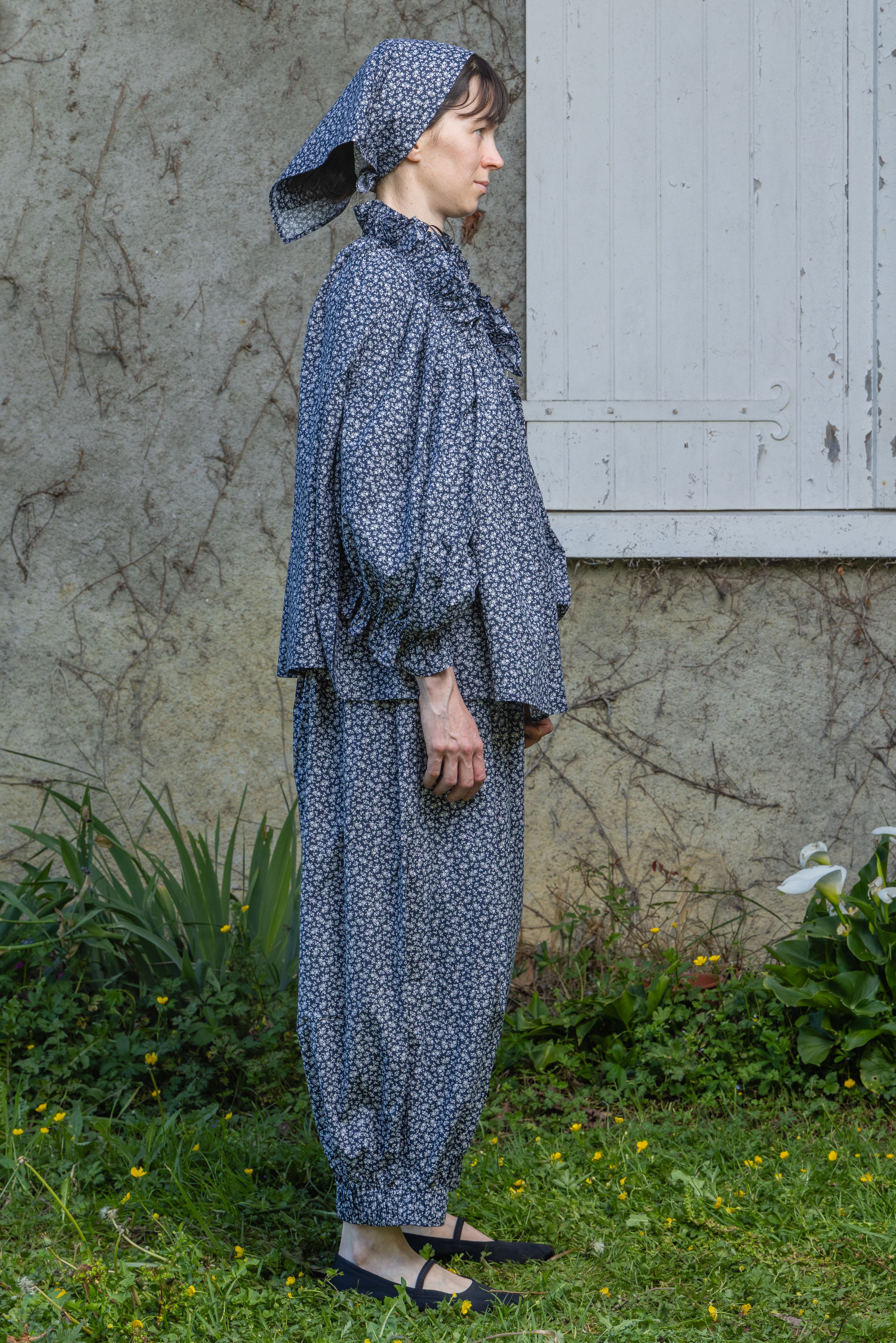 Navy floral peasant top with gathered high neck and long balloon sleeves