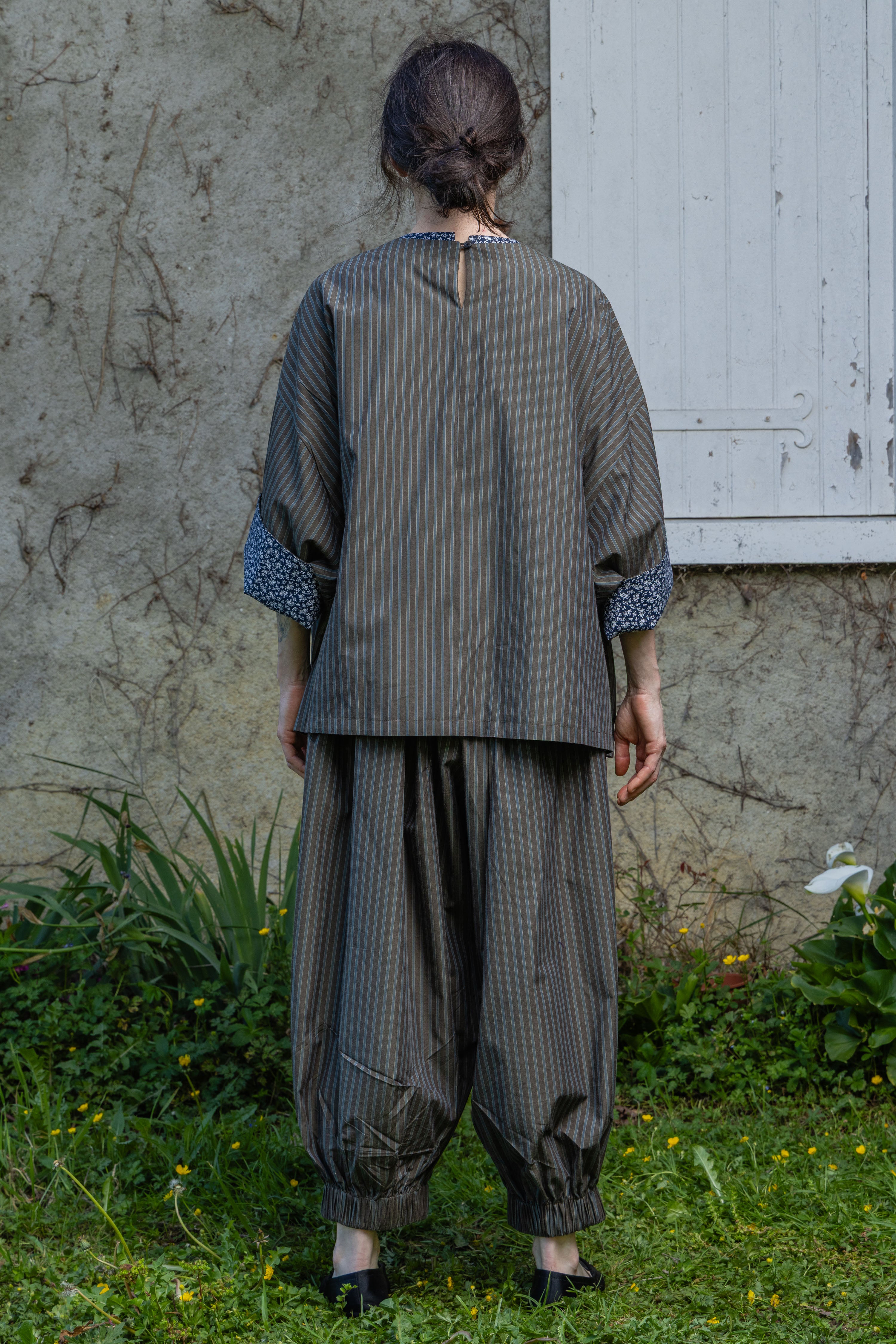 Loose striped top, back view with neck opening and patterned contrast cuffs