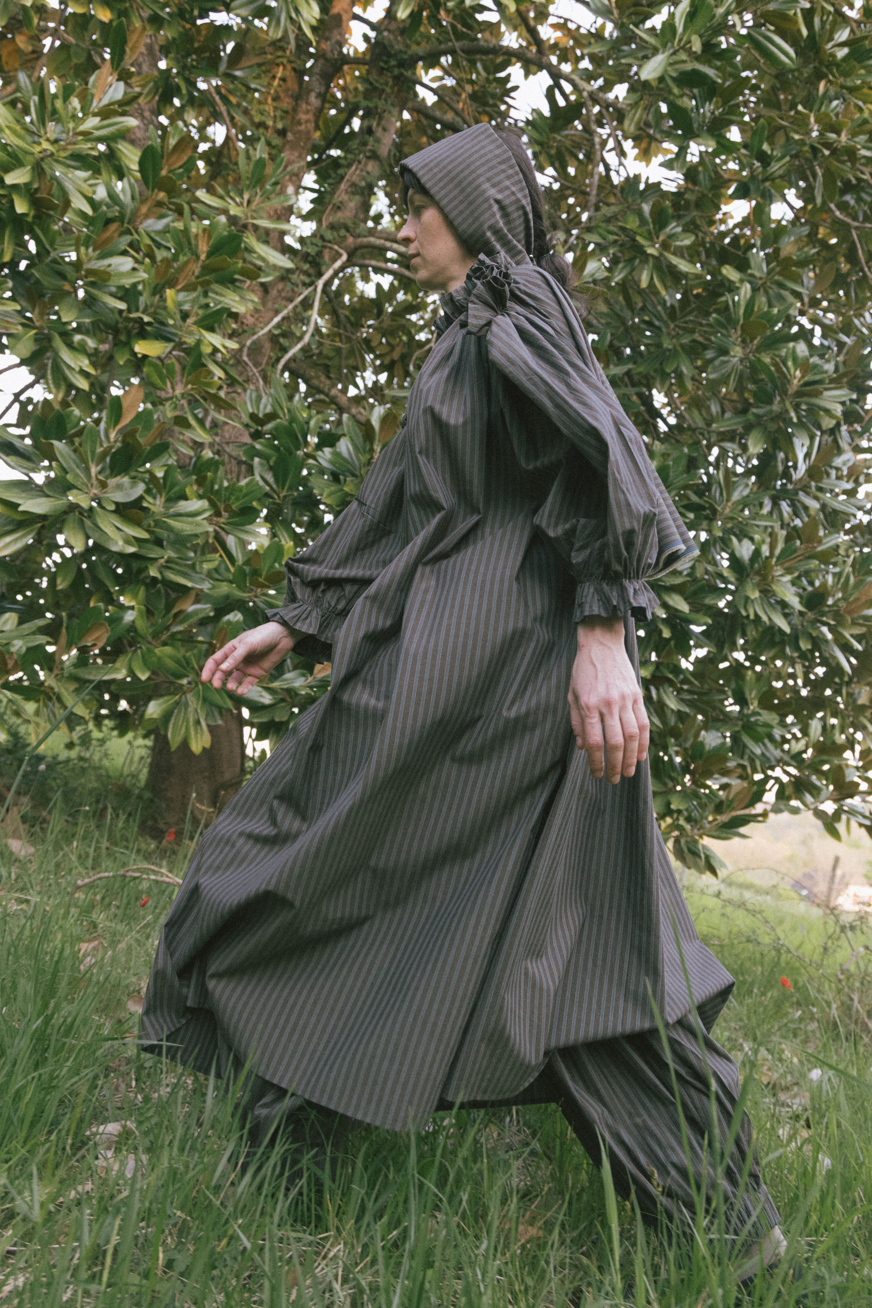 Olive striped midi dress with ruffled high collar and puff sleeves, gathered waist.