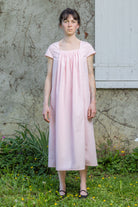 Pink Hier dress with gathered neckline and short sleeves, front view, knee-length