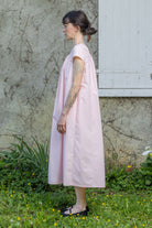 Pink Hier dress, back view with gathered yoke and short sleeves, knee-length