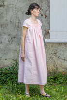 Pink Hier dress with gathered yoke and short sleeves, side view, knee-length