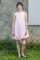 Pink bubble dress with sleeveless bodice and gathered bubble skirt hem