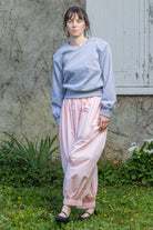 Heather grey V-neck knit top with long sleeves, slight dropped shoulders