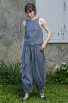 Navy floral sleeveless tank top with round neck and gathered waist hem