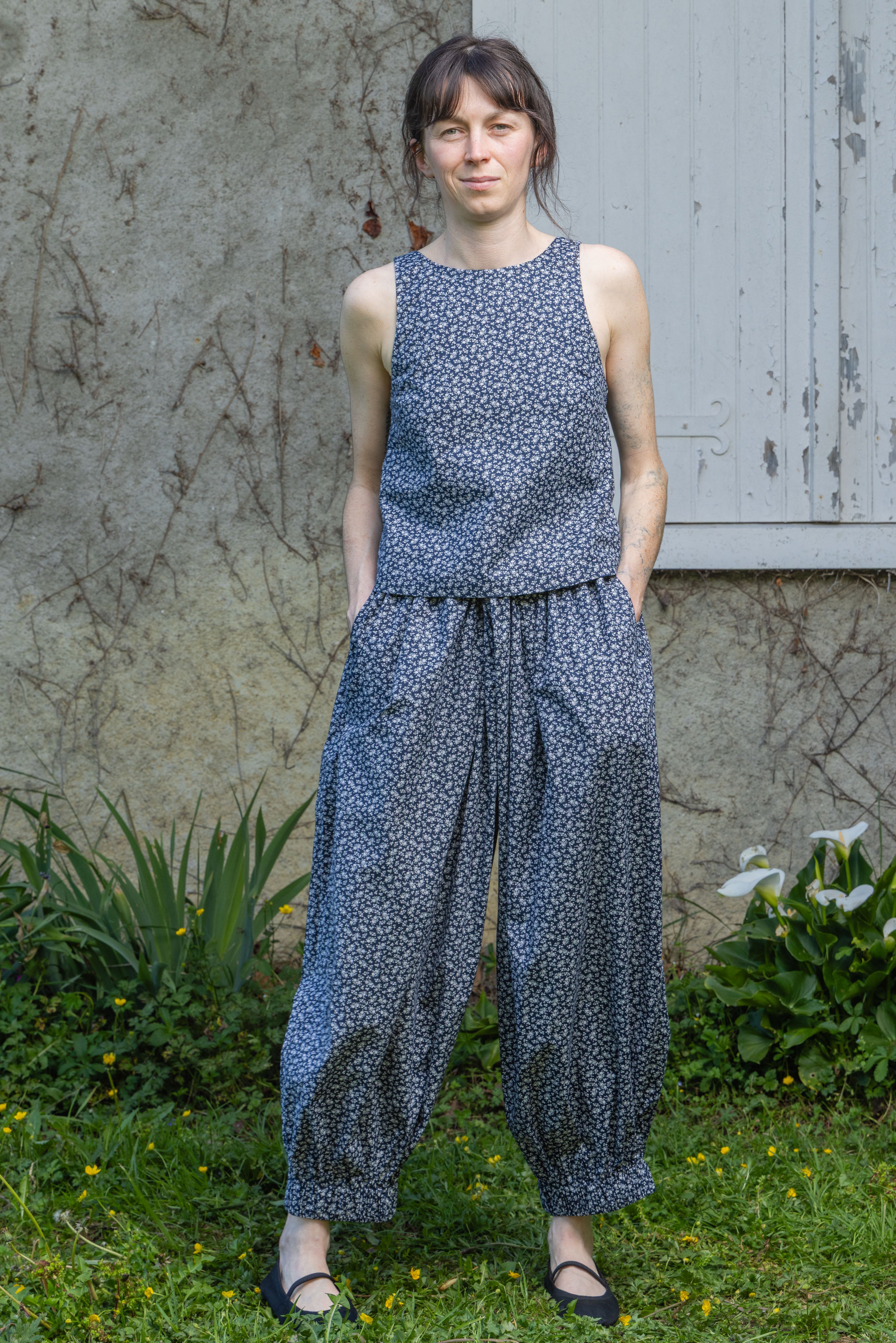 Navy floral sleeveless tank top with round neck and gathered waist hem