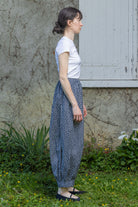 Navy floral wide-leg trousers with elastic waist and ankle-length hem