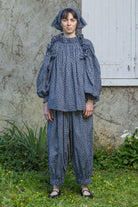 Navy floral peasant top with gathered neckline and balloon sleeves with cap