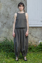 Olive stripe sleeveless tank top with rounded neck and gathered hem