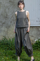 Olive stripe sleeveless tank top with rounded neck and gathered hem