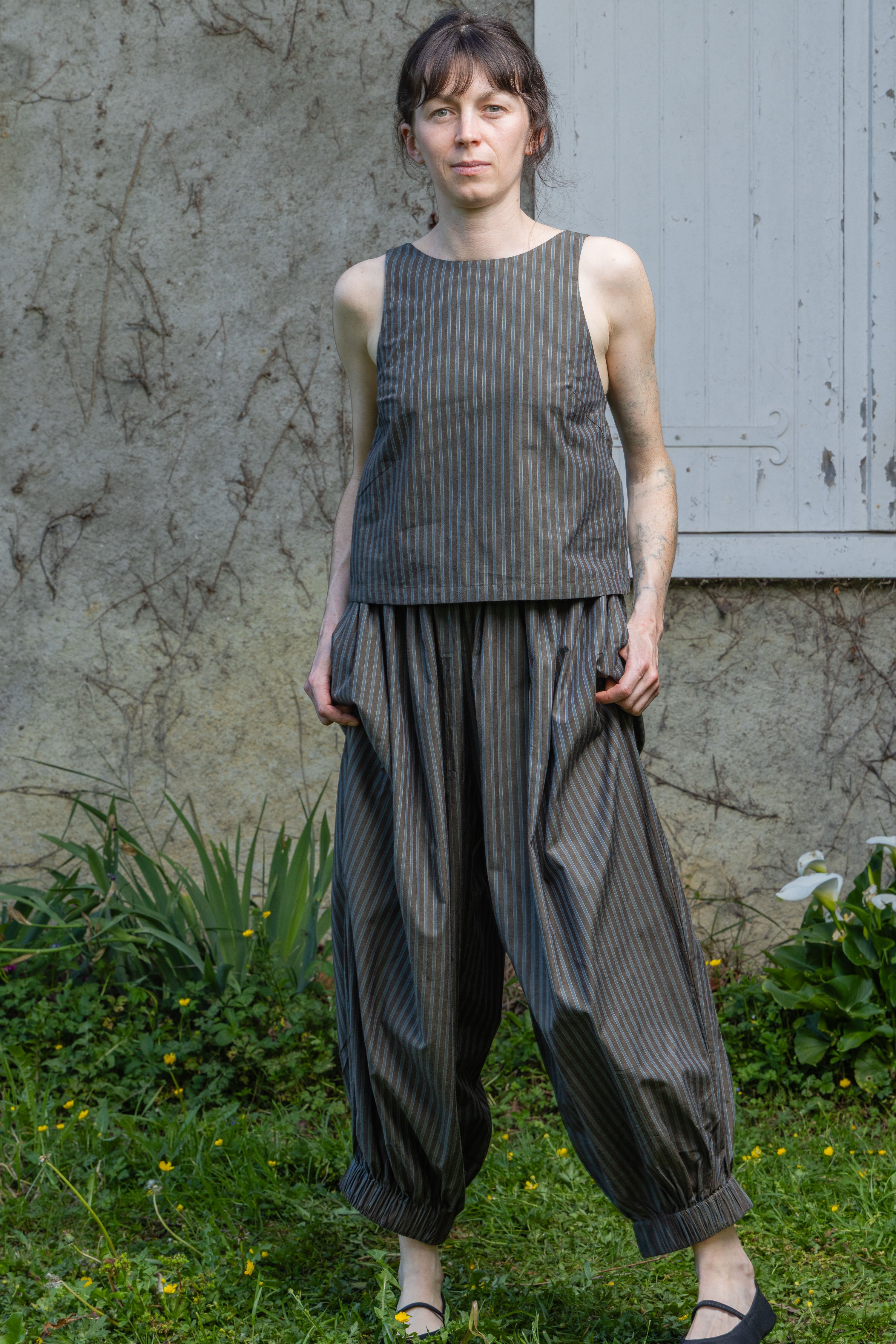 Olive stripe sleeveless tank top with rounded neck and gathered hem