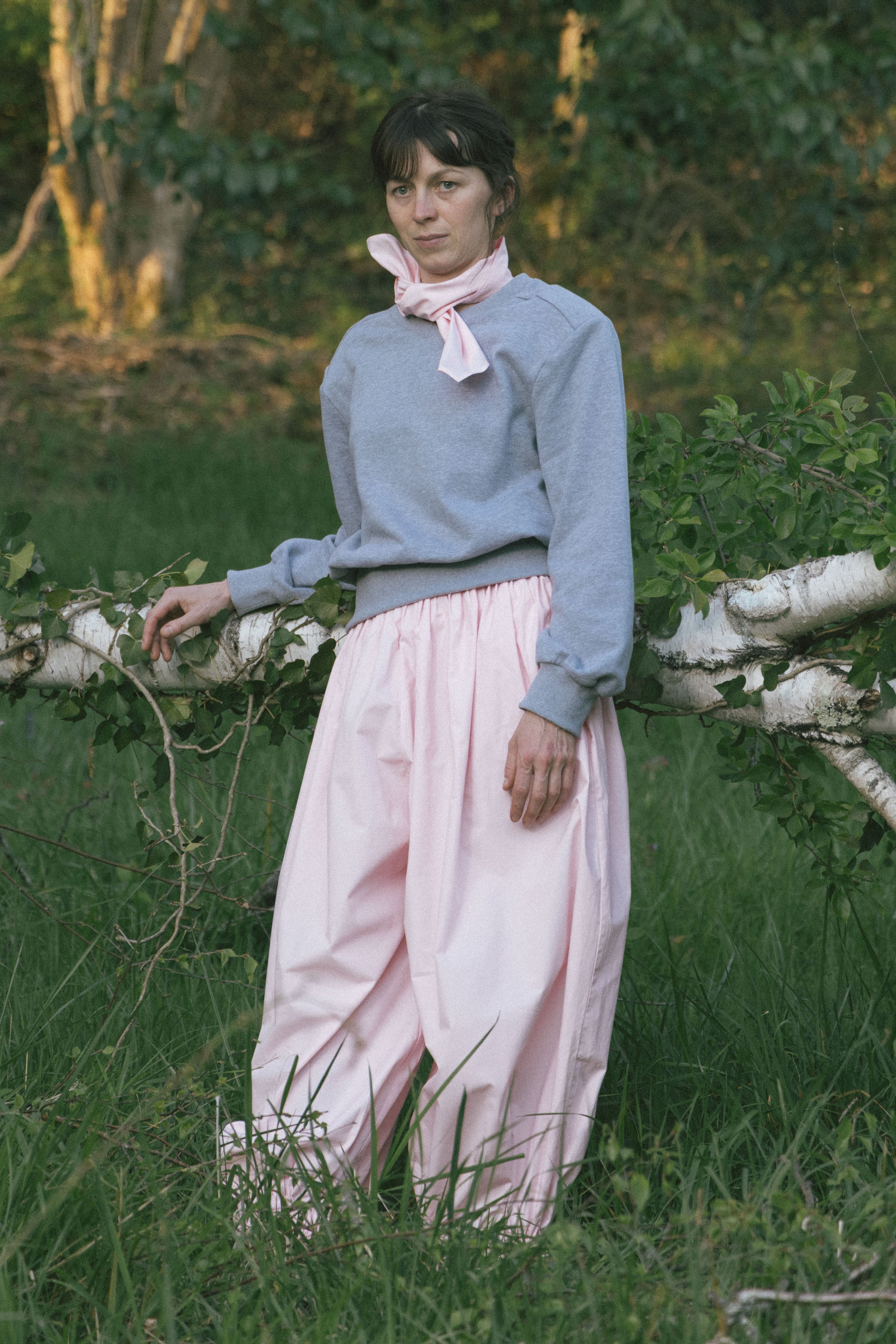 Heather grey long-sleeve crewneck top with ribbed cuffs